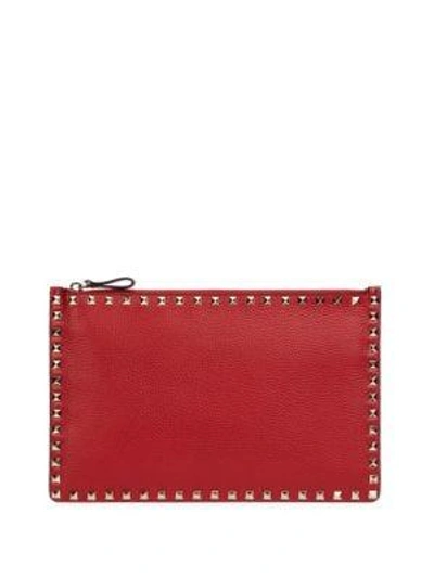 Shop Valentino Garavani Large Rockstud Leather Pouch In Red