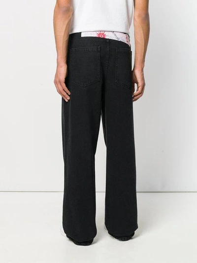 Shop Raf Simons Wide Leg Jeans In Black