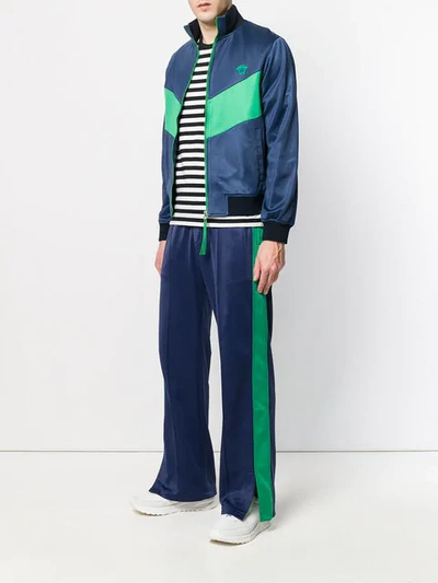 Shop Versace Two Tone Track Pants In Blue