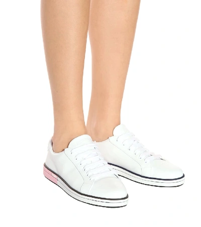 Shop Prada Leather Sneakers In White