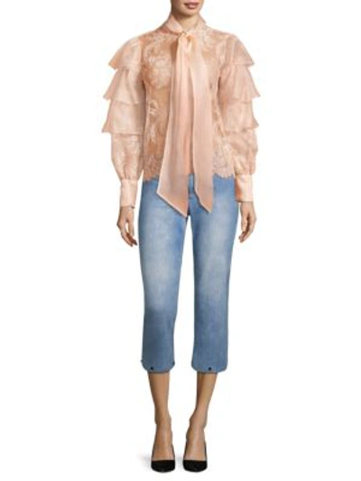 Shop Alice And Olivia Tasha Cropped Feather Hem Jeans In 90s Wash