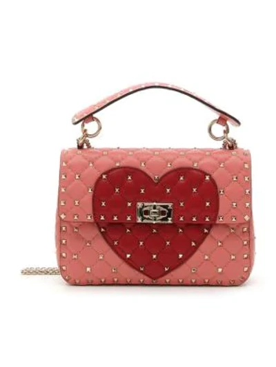 Shop Valentino Medium Rockstud Spike Heart Leather Shoulder Bag In Red Pink