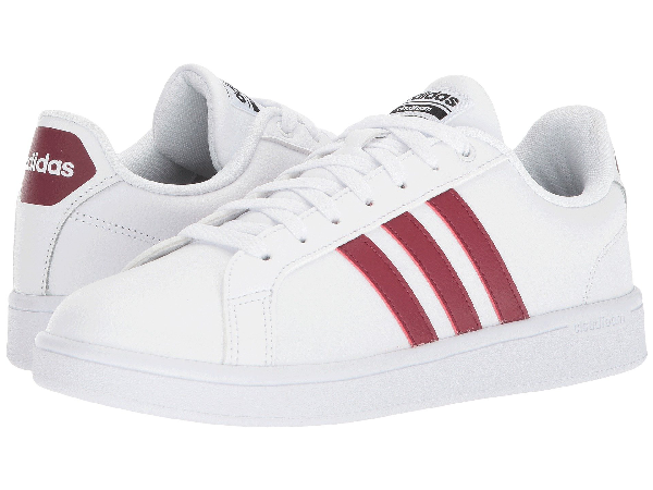 white adidas with burgundy stripes