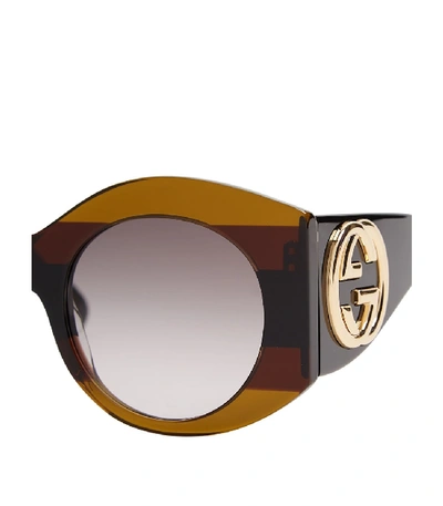 Shop Gucci Striped Round-frame Acetate Sunglasses In Brown