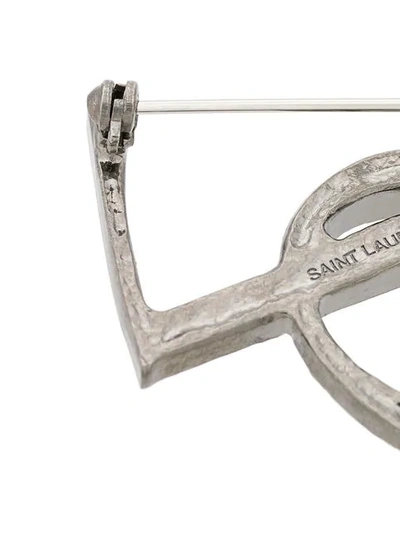 Shop Saint Laurent Monogram Brooch In Metallic