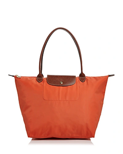 Shop Longchamp Le Pliage Large Nylon Shoulder Tote In Orange/gold