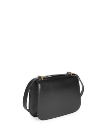 Shop Saint Laurent Smooth Monogrammed Leather Saddle Bag In Noir