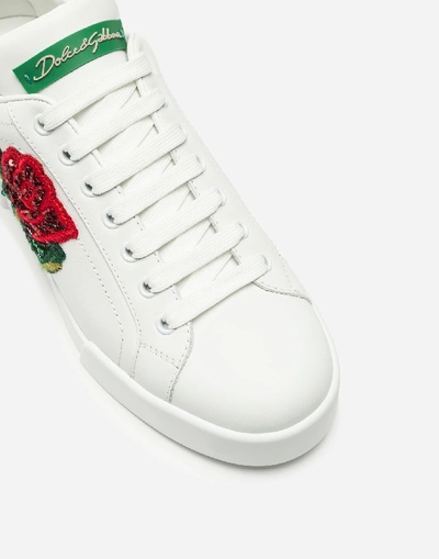 Shop Dolce & Gabbana Portofino Leather Sneakers With Rose Patch In White