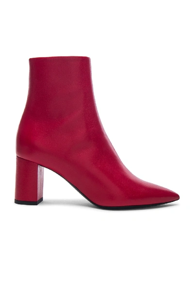 Shop Saint Laurent Leather Betty Heeled Ankle Boots In Red