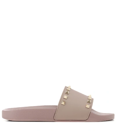 Shop Valentino Garavani Rockstud Slides In Beige