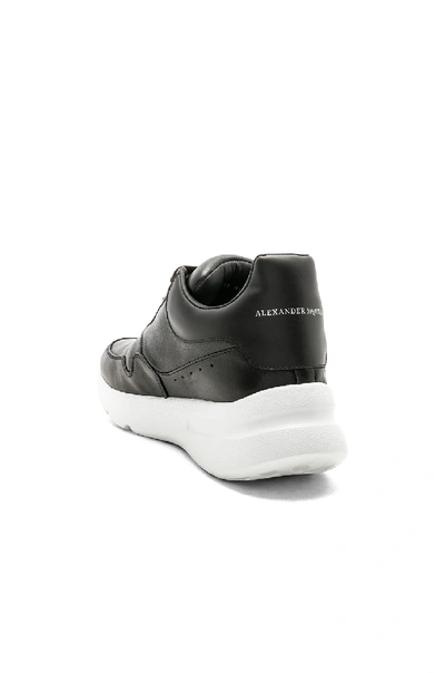 Shop Alexander Mcqueen Leather Lace Up Sneakers In Black