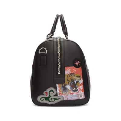 Shop Gucci Black Gg Supreme Patches Duffle Bag