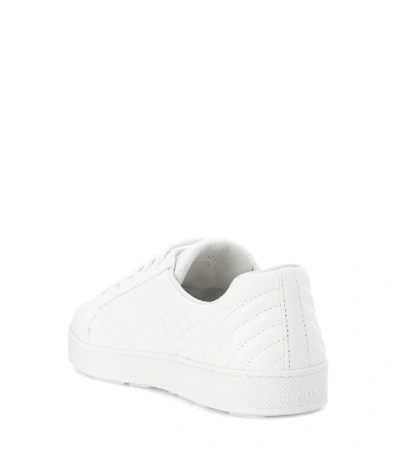 Shop Prada Quilted Leather Sneakers In White