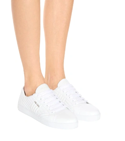 Shop Prada Quilted Leather Sneakers In White