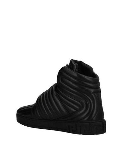 Shop Versace Sneakers In Black