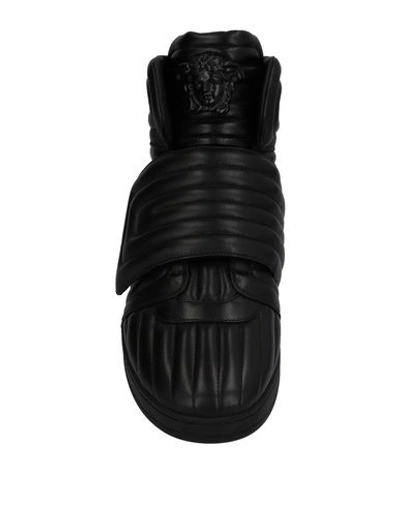 Shop Versace Sneakers In Black