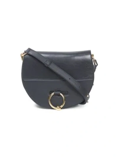 Shop Jw Anderson Pierced Leather Latch Bag In Black