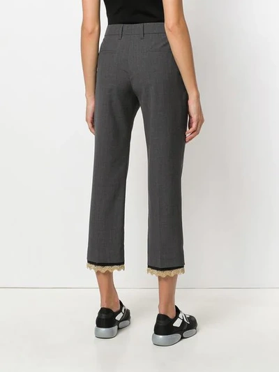 Shop Prada Embellished Hems Trousers In Grey