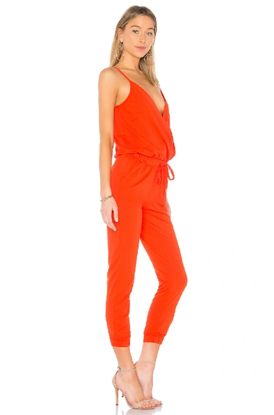 Shop Bobi Supreme Jersey Surplice Jumpsuit In Red