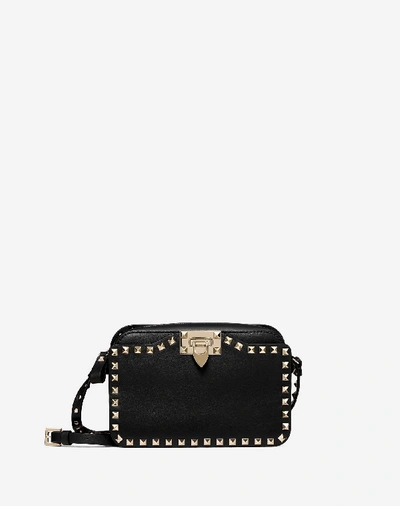 Shop Valentino Small Rockstud Crossbody Bag In Black