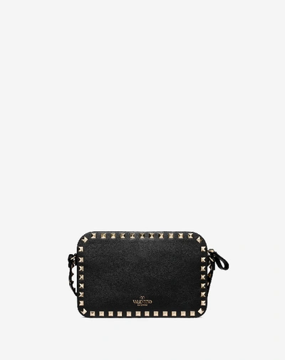 Shop Valentino Small Rockstud Crossbody Bag In Black