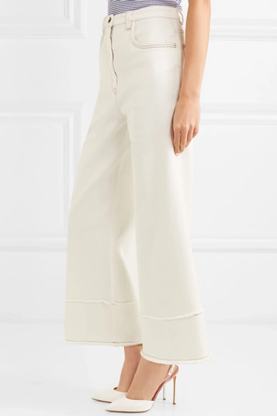 Shop Miu Miu Cropped Frayed High-rise Flared Jeans In Ivory