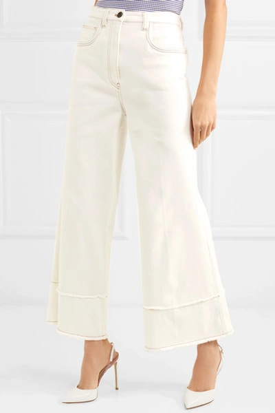 Shop Miu Miu Cropped Frayed High-rise Flared Jeans In Ivory