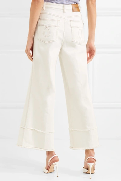 Shop Miu Miu Cropped Frayed High-rise Flared Jeans In Ivory