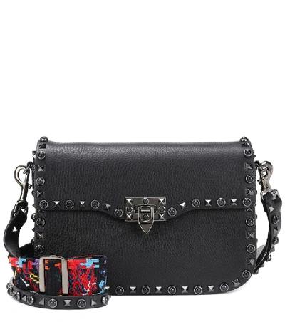 Shop Valentino Garavani Rockstud Rolling Leather Shoulder Bag In Black