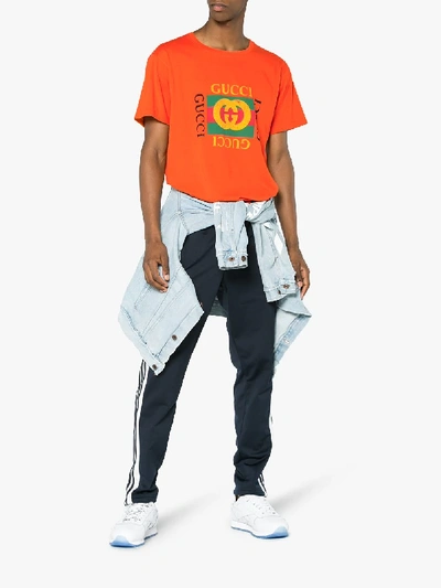 Shop Gucci Orange Fake Logo T Shirt In Yellow/orange