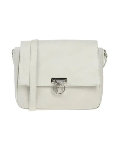 Shop Versace Handbags In White