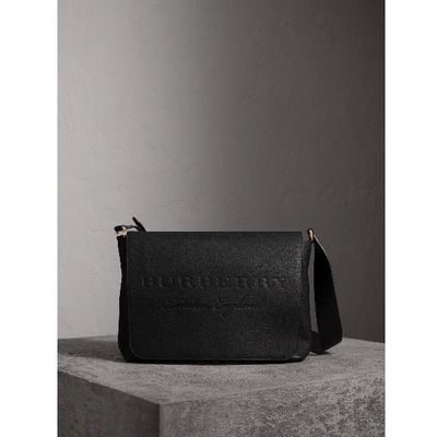 Shop Burberry Large Embossed Leather Messenger Bag In Black