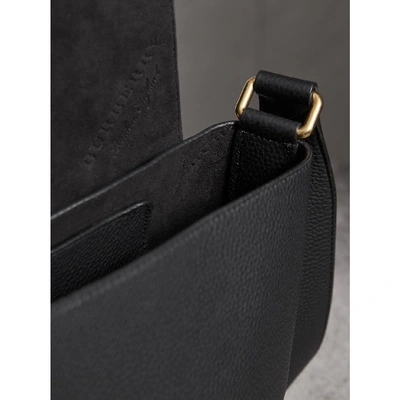 Shop Burberry Large Embossed Leather Messenger Bag In Black