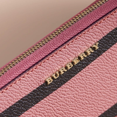 Shop Burberry Trompe L'oeil Print Leather Ziparound Wallet In Dusty Pink