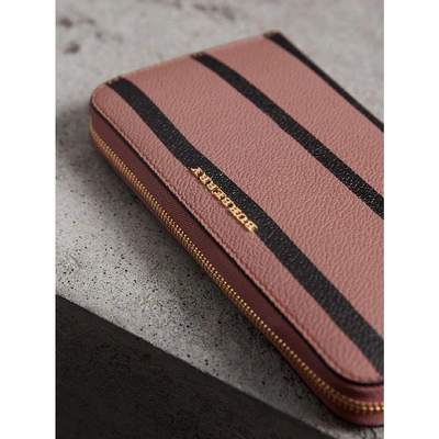 Shop Burberry Trompe L'oeil Print Leather Ziparound Wallet In Dusty Pink