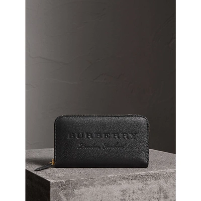 Shop Burberry Embossed Leather Ziparound Wallet In Black