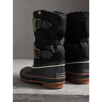 Shop Burberry Rubber Leather Blend Duck Boots In Black