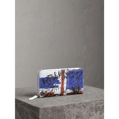 Shop Burberry Doodle Print Coated Canvas Ziparound Wallet In Red/blue