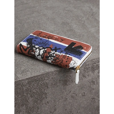 Shop Burberry Doodle Print Coated Canvas Ziparound Wallet In Red/blue