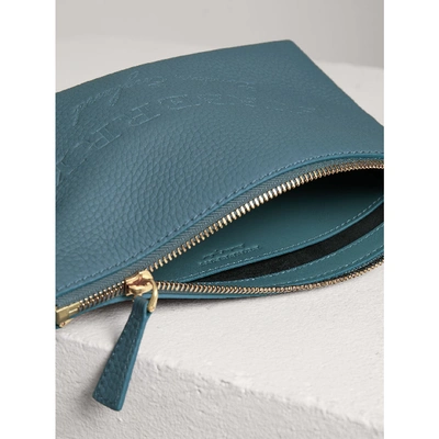 Shop Burberry Medium Embossed Leather Zip Pouch In Dusty Teal Blue
