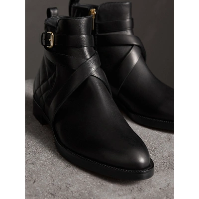 Shop Burberry Strap Detail Quilted Leather Ankle Boots In Black