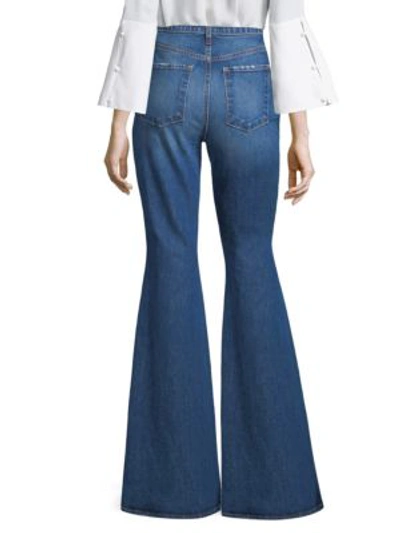 Shop Ao.la Floral Embroidered Bell-leg Jeans In Secret Meeting