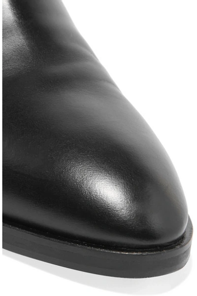 Shop Alaïa Appliquéd Cutout Leather Ankle Boots