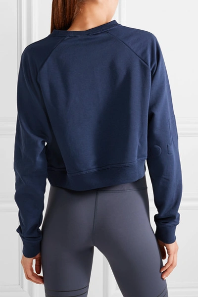 Shop Nike Pro Versa Cropped Embossed Jersey Sweatshirt In Navy