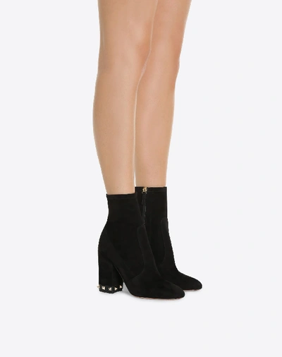 Shop Valentino Rockstud Bootie In Black