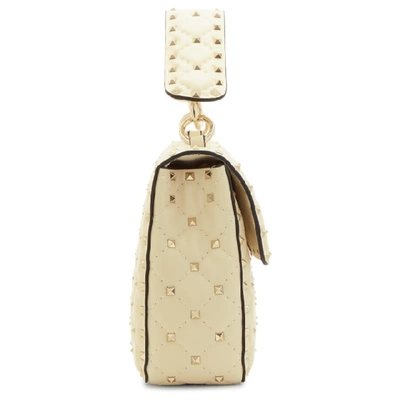 Shop Valentino Ivory  Garavani Medium Quilted Rockstud Spike Bag In I16 Ivory