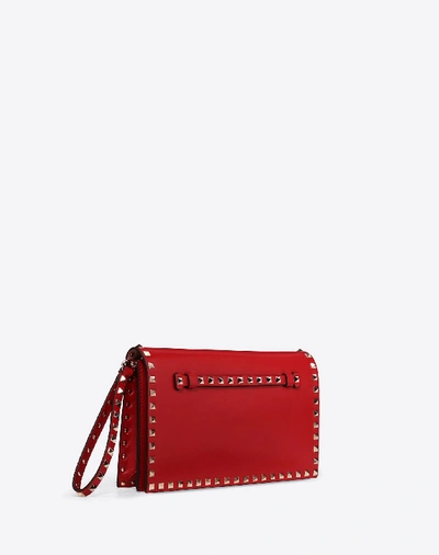 Shop Valentino Garavani Medium Rockstud Clutch In Rosso