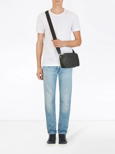 Shop Fendi Embossed Ff Shoulder Bag In Black