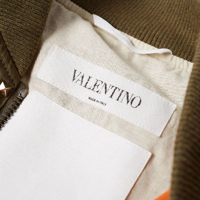 Shop Valentino Rockstud Bomber Jacket In Green