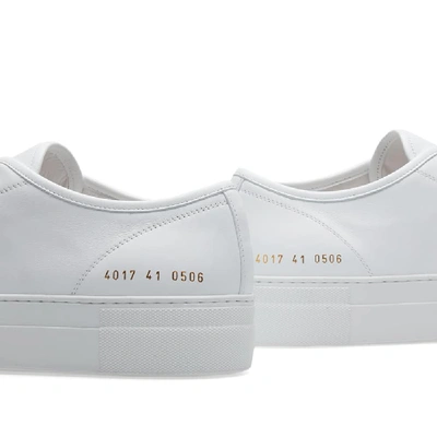 Shop Common Projects Woman By  Tournament Low Super Sole In White